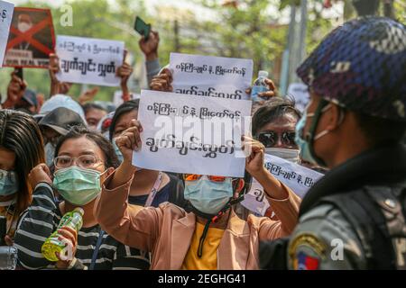 Protesters holding placards expressing their opinion, at the court building.Demonstrators gathered at the court hearing and demanded the release of the detained Mandalay Chief Minister, Dr. Zaw Myint Maung who was charged under section 505 (B) at Aung Myay Tharzan Township court following a lawsuit filed after a statement was issued by the National League for Democracy (NLD) central executive committee on February 1st, according to the court official. The Prime Minister has been detained since February 1st and was arraigned on video conferencing court, according to the prosecutors. Stock Photo