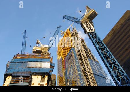 low view of the cranes to build new skyscrapers in the City of London Stock Photo
