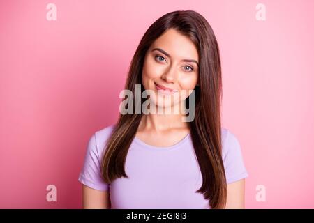 Photo portrait of pretty cute female student smiling wearing casual clothes isolated on pastel pink color background Stock Photo