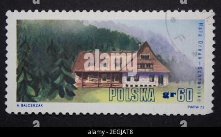 KHARKIV, UKRAINE - MAY 3, 2020: Vintage stamp printed by USSR, shows a cabin in the woods on a mountainside, circa 1972 Stock Photo