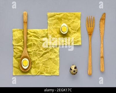quail eggs on waxed napkin, wooden cutlery, easter concept Stock Photo