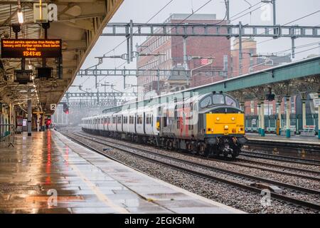 Rail Operations Group class 37 No. 37884 travels through Newport Station with two Greater Anglia 321 EMU's Nos. 321357 and 321446 Stock Photo