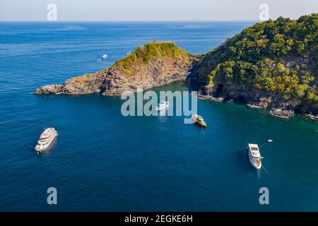 Aerial view of SCUBA diving boats moored above a coral reef at Ko Bon, Similan Islands, Thailand Stock Photo