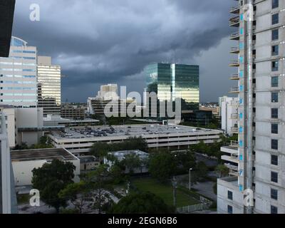USA, Fort Lauderdale - July 24, 2019 - Big cloud formation over downtown Fort Lauderdale during rain season, dramatic sky reflected on building Stock Photo
