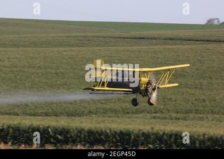 ag flies spraying biplane