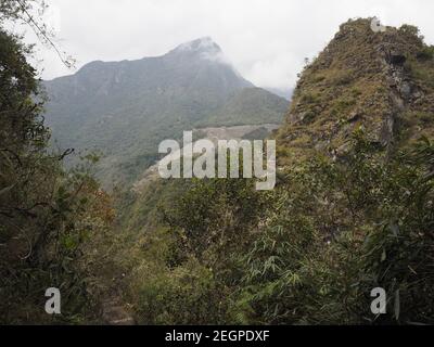 View of Machu Picchu and the trail that leads to the top of WaynaPicchu mountain Stock Photo