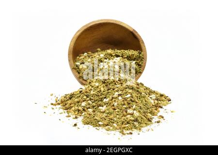 zaatar or zatar in vintage wooden bowl isolated on white background Stock Photo