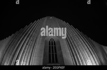 Reykjavik, Iceland - December 5, 2017 - Looking up Hallgrimskirkja Cathedral tower at night in Reykjavik Iceland, black and white picture Stock Photo