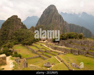 Wayna Picchu mountain view from Machu Picchu, below inca trraces for planting crops Stock Photo