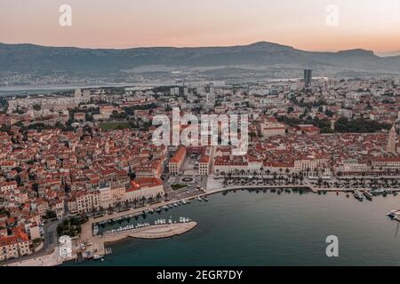 Aerial drone shot of Republic Palace by Diocletian Palace in Split old town before sunrise in morning Stock Photo