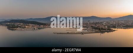 Aerial panoramic drone shot of ferry port in Split old town before sunrise in early morning Stock Photo