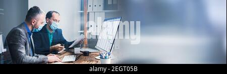 Business Man Workers In Office With Medical Mask Stock Photo