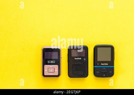 jerusalem-israel. 03-02-2021. Three black mp3 players on a yellow background Stock Photo