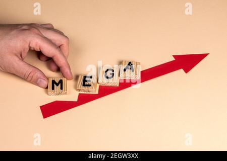 MEGA. Business concept. Red arrow indicates the development and growth. Steps. Stock Photo