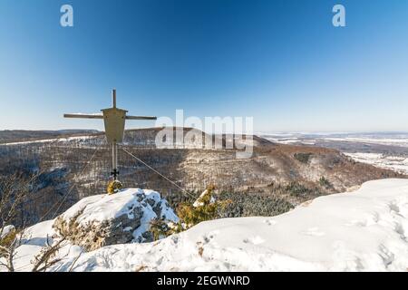 Summit cross on a mountain peak in a beautiful winter landscape in the Swabian Alps Stock Photo