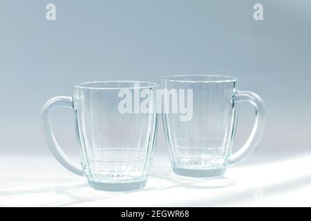 Two empty beer mug on grey background. Stock Photo