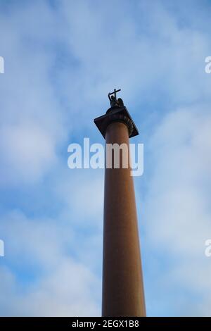 Saint Petersburg, Russia. Alexander Column with an angel on its top against cloudy blue sky Stock Photo