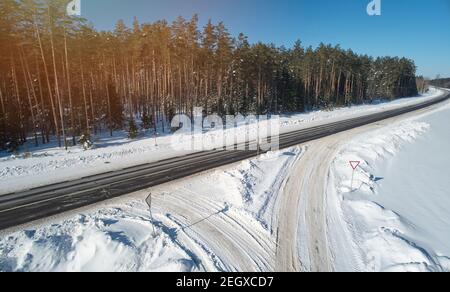 Road intersection on winter time aerial drone view Stock Photo