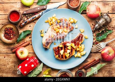 Fried meat steak with caramelized apple.Autumn food Stock Photo