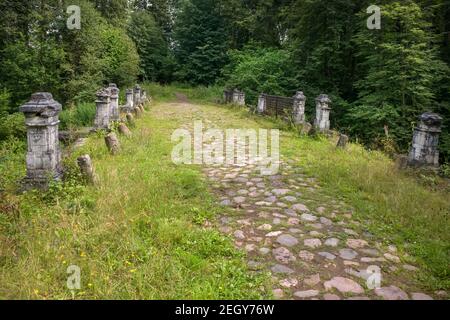 The remains of the railing of the Big white stone bridge in the park of the Serednikovo estate on a summer day Stock Photo