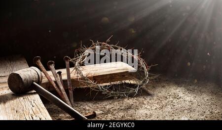 Passion Of Jesus - Wooden Cross With Crown Of Thorns Hammer And Bloody Spikes Stock Photo