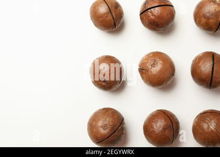 Flat lay with tasty macadamia nuts on white background Stock Photo
