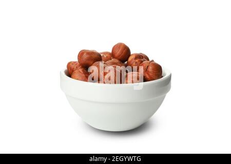 Bowl with tasty hazelnuts isolated on white background Stock Photo
