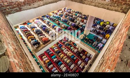 Barishal, Barishal, Bangladesh. 19th Feb, 2021. Despite having critical Covid-19 Pandemic situition in Bangladesh, people gather in a large number in Mosque without social distancing to say their Jummah Prayer in Barishal city in Bangladesh. Credit: Mustasinur Rahman Alvi/ZUMA Wire/Alamy Live News Stock Photo