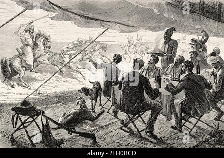The Moroccan tradition of Fantasia. Lab al baroud. Uunpowder game or Tbourida, is a stylized reenactment of a wartime cavalry charge, a celebration of the region's history and of the bond between horse and rider. Morocco, North Africa. Old 19th century engraved illustration from El Mundo Ilustrado 1879 Stock Photo