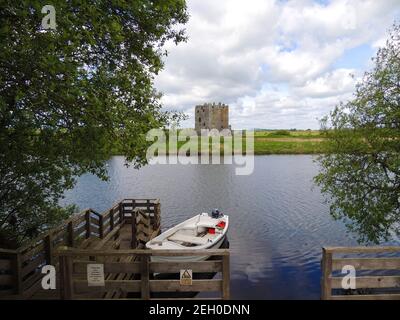 Threave Castle on the River Dee near Castle Douglas, Dumfries and galloway, Scotland. The castle stands on an island and is only accessible by a small boat ride. It was built in the 1370s by Archibald the Grim and was a stronghold of the "Black Douglases", Earls of Douglas and Lords of Galloway. The keep and artillary house remain standing. After a seige during  in the Bishop's War The Covenanters ordered the buildings to be dismantled, and the materials to be disposed  for  use by  the public. Stock Photo