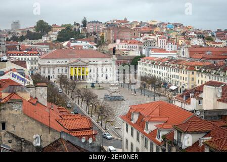 LISBON, PORTUGAL - APRIL 13, 2016: Early morning view of the Rossio Square at the center of Lisbon, Portugal. Rossio square has been one of its main s Stock Photo