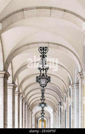Hallway with columns surrounding the Commerce Square in Lisbon, Portugal Stock Photo