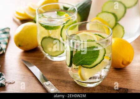Sassy water or water with cucumber,lemon, ginger and mint on wooden table Stock Photo