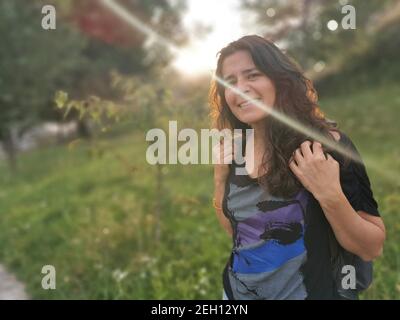 Happy woman hiking in the woods Stock Photo