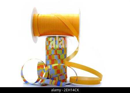 Closeup of rolls of multicolored various ribbons for packing and decorating gifts Stock Photo