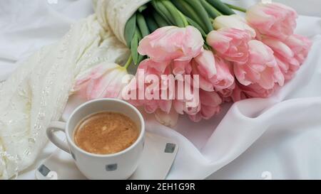Violet cup of morning coffee or cappuccino and delicate purple, lilac  flowers. Mother's day concept. Cozy breakfast Stock Photo - Alamy
