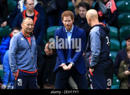 File photo dated 17/02/17 of the then Prince Harry (now the Duke of Sussex), Patron of the Rugby Football Union (RFU) chatting with England head coach Eddie Jones during an England Rugby training session at Twickenham Stadium, London. The Duke and Duchess of Sussex have confirmed to Queen Elizabeth II that they will not be returning as working members of The Royal Family. Issue date: Friday February 19, 2021. Stock Photo