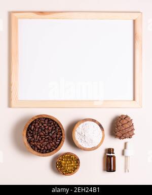 Natural product concept, template for writing text. Pine nuts, oil, extract. White sheet in a frame, top view Stock Photo