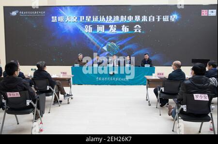 (210219) -- BEIJING, Feb. 19, 2021 (Xinhua) -- Zhang Shuangnan (C), lead scientist of China's Hard X-ray Modulation Telescope (HXMT), speaks during a press conference at the Institute of High Energy Physics under the Chinese Academy of Sciences in Beijing, capital of China, Feb. 19, 2021. China's HXMT, the country's space science satellite also known as Insight, has found that a fast radio burst signal detected last year came from a magnetar in the Milky Way, Chinese scientists announced Friday.   The discovery marked a milestone in understanding the nature of the mysterious signal emanating f Stock Photo