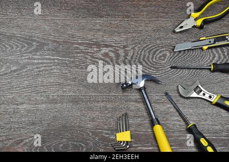 Tools on a wooden background with copy space. Various tools on wooden background. Repairmen and worker concept. Stock Photo