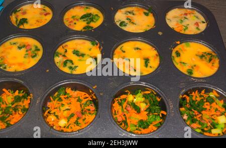 Healthy vegan oat muffins, apple and banana cakes in vintage pan Grey textile background Top view Stock Photo