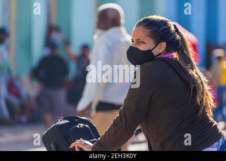 Woman wearing a 'nasobuco' to protect herself from the coronavirus in Cuba. Stock Photo