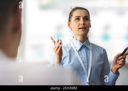 business leadership seminar. woman speaker giving a presentation in a conference Stock Photo