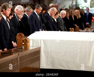 The white draped casket of Senator Edward Kennedy sits before (from left) the Senator's son Edward Kennedy Jr., his widow Vicki Kennedy, former President Bill Clinton, Secretary of State Hillary Clinton, former president George W. Bush, President Barack Obama and First Lady Michelle Obama, Vice President Joseph Biden and his wife Jill Biden, and former First Lady Rosalynn Carter and former President Jimmy Carter during funeral services at the Basilica of Our Lady of Perpetual Help in Boston, Mass. on Aug. 29, 2009. Stock Photo