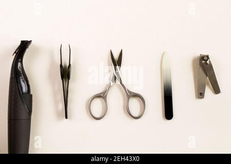 Scissors and other instruments for nails on the white background Stock Photo