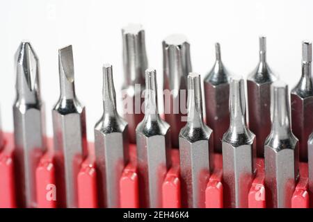 Closeup of different drill bits isolated in the white background Stock Photo