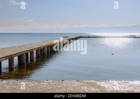 Concrete pier on big lake in Europe Stock Photo