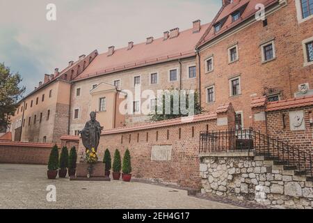 Monument of Pope Saint John Paul II near Cathedral museum in Wawel Castle Stock Photo