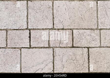 Granite tiles on the floor. Texture of old marble close up. Stock Photo