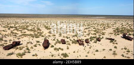 Boats in desert around Moynaq, Muynak or Moynoq - Aral sea or Aral lake - Uzbekistan - asia Stock Photo